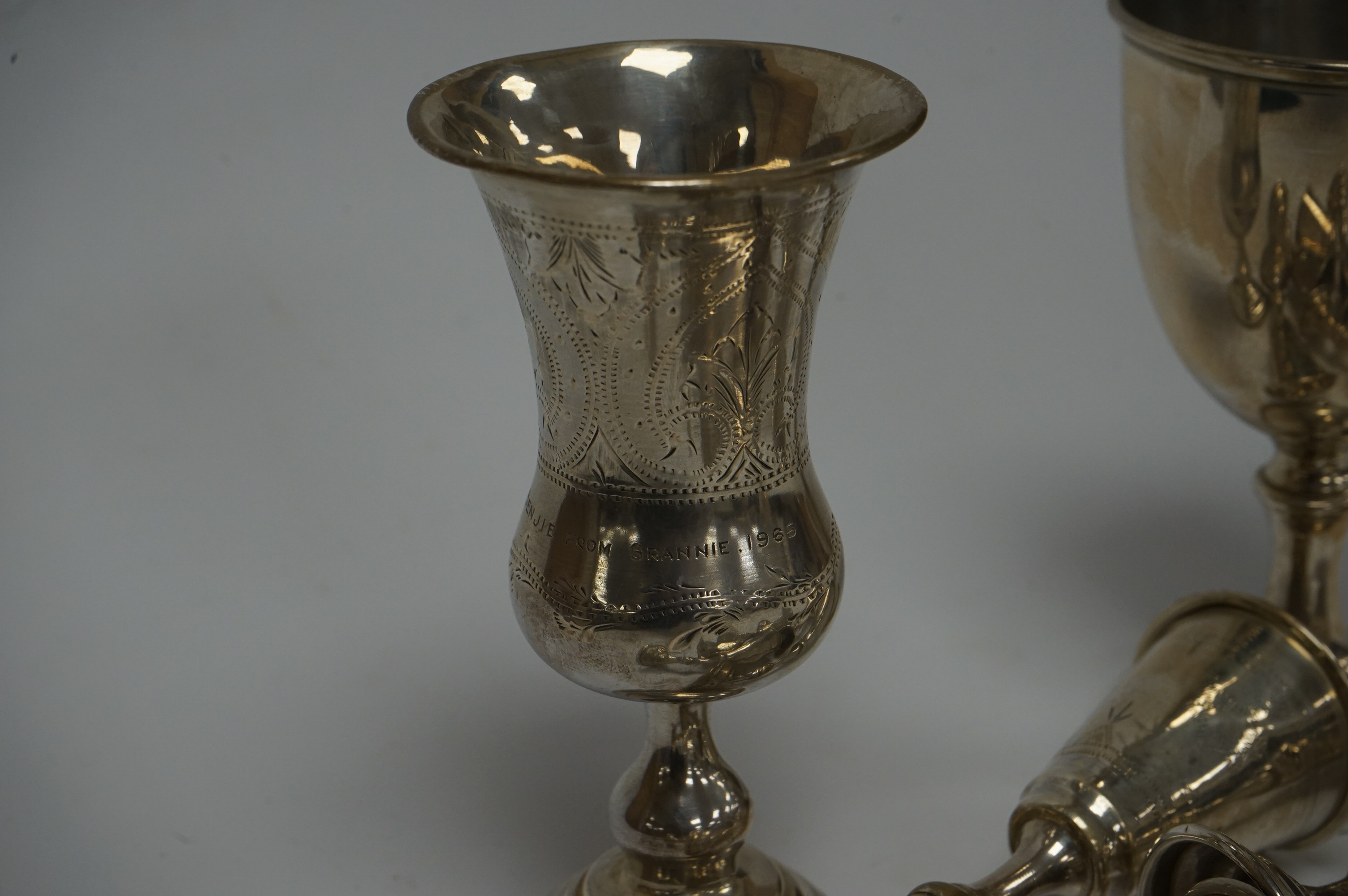 A set of six George V silver kiddush cups, maker MS?, London, 1924, 95mm, together with one other larger earlier silver kiddush cup and a 1960's silver goblet. Condition - poor to fair